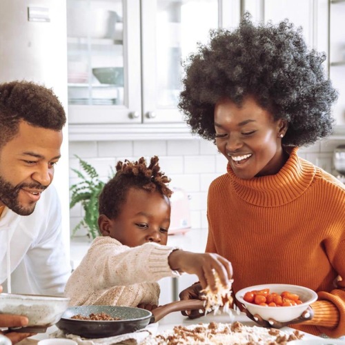 a family cooking together
